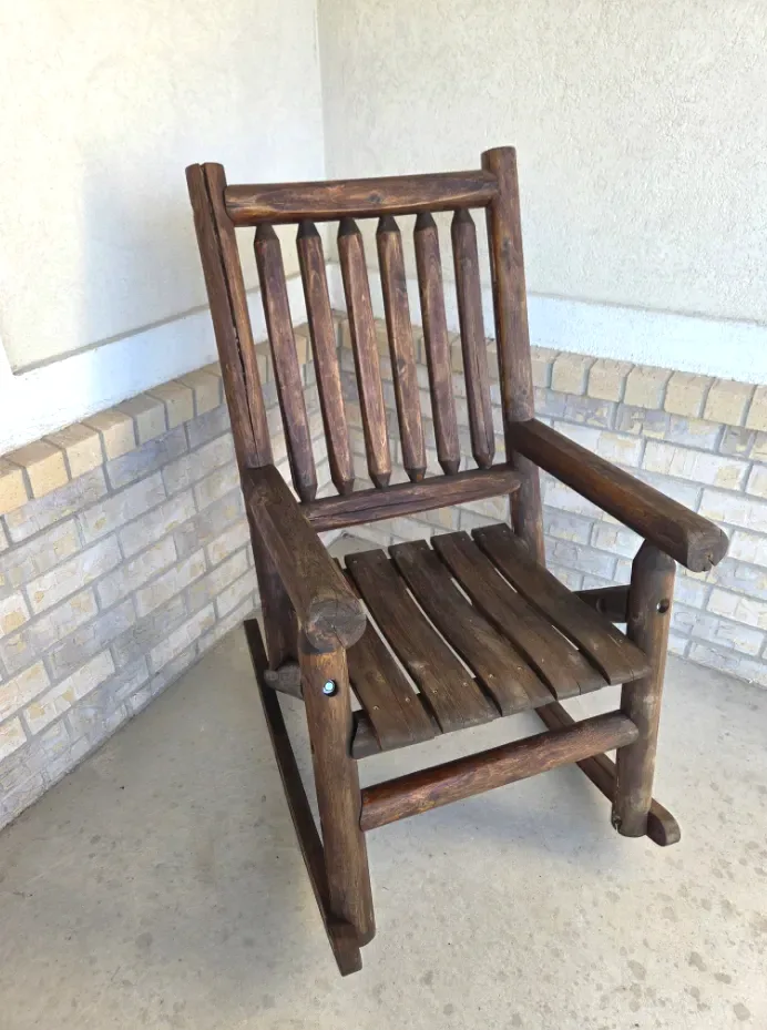 Log rocking chair after sanding, staining, and refinishing