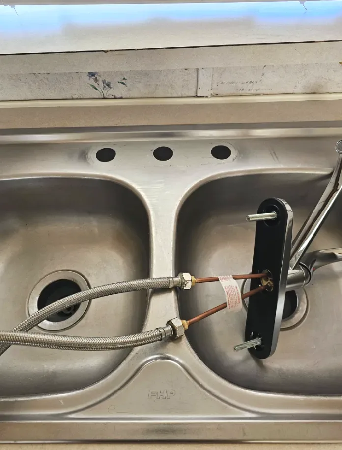 Old faucet supply lines removed before the new install