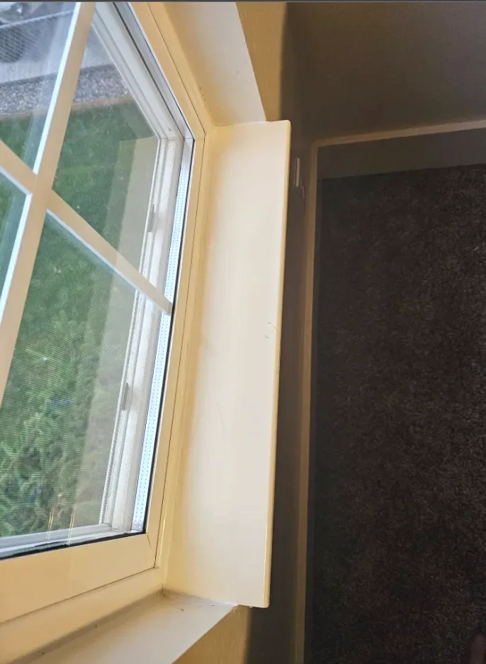 Window with freshly repaired and painted trim